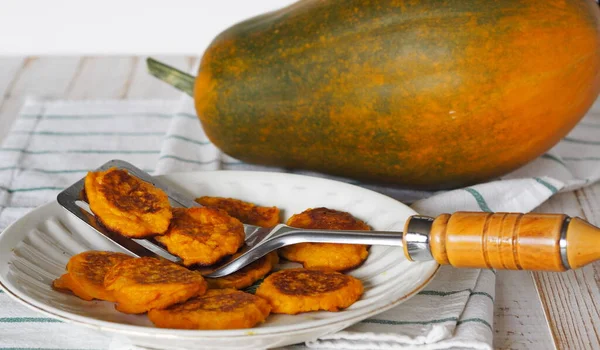 Diet natural pancakes from pumpkin and millet on a wooden white table. Autumn food background with pumpk — Stock Image Diet Natural Pancakes Pumpkin Millet Wooden White Table Autumn Food Stock Photo