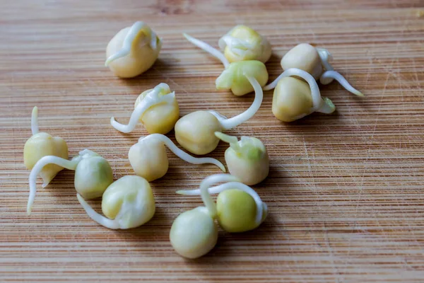 Healthy Food Vegans Raw Food Eaters Scattering Sprouted Sweet Peas — Stock Photo, Image