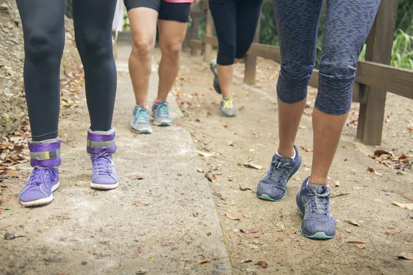 Selective Focus Close Four Unrecognizable Women Legs Outdoor Exercising Rural Stock Photo