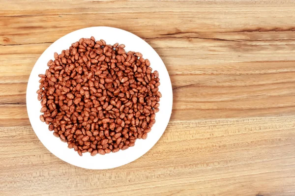 Chocolate rice - puffed rice-shaped chocolate flakes made from rice and wheat flour.