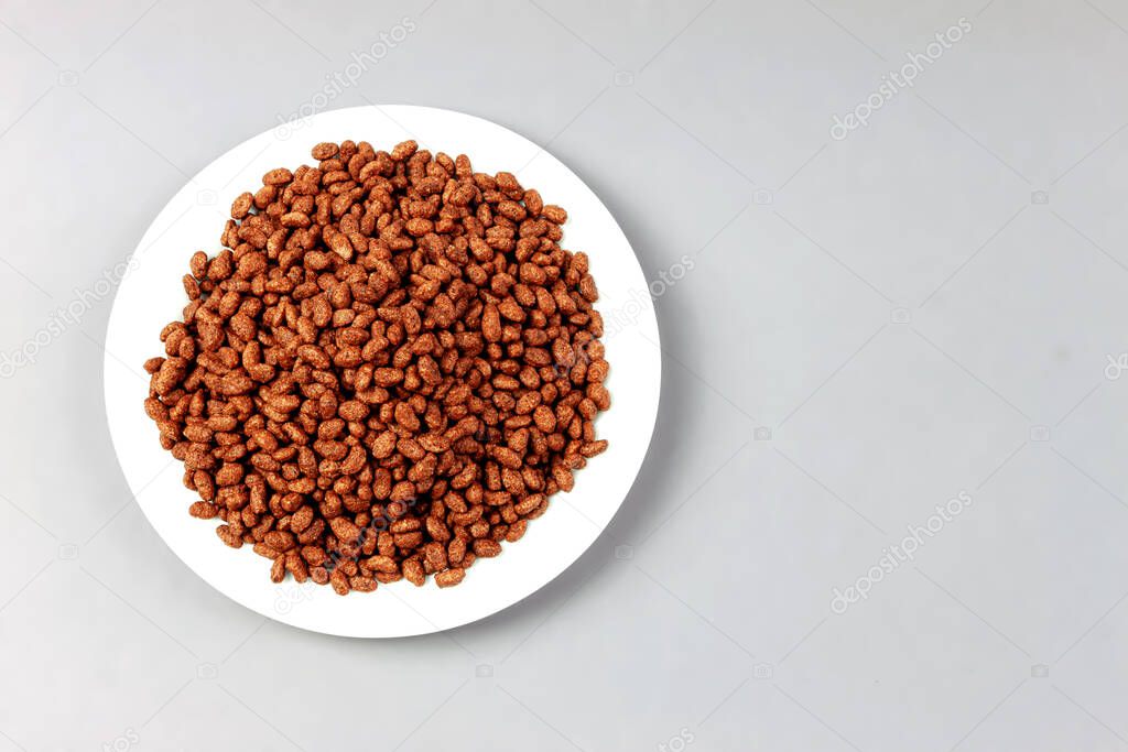 Chocolate rice - puffed rice-shaped chocolate flakes made from rice and wheat flour.