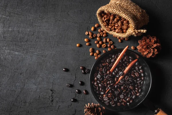 Raw coffee beans in sack bags and roasted coffee beans