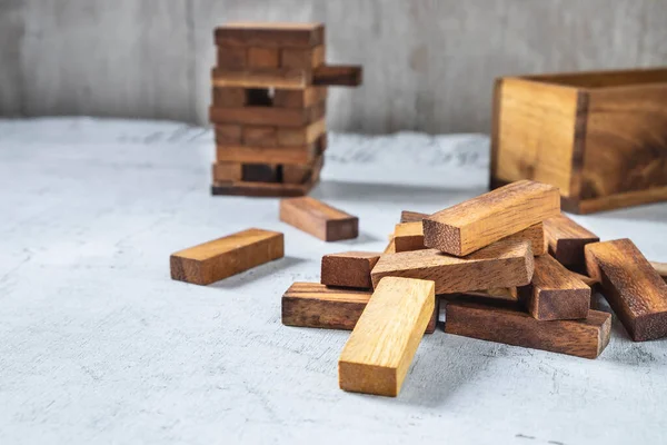 blocks wood game (jenga) on wooden table
