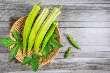 Raw okra in basket clipart