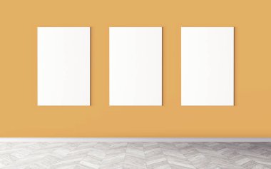 Duvarda üç tane boş tuval var. Tasarım önizlemeniz için bir model. Reklam malzemeleri için iyi bir kullanım.