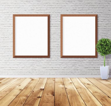 Duvarında çerçeve olan beyaz posterler. Tasarım ön gösterimi için hazırlan. Reklam malzemeleri için iyi bir kullanım.