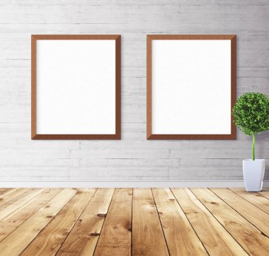 Duvarında çerçeve olan beyaz posterler. Tasarım ön gösterimi için hazırlan. Reklam malzemeleri için iyi bir kullanım.