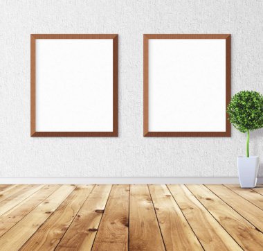 Duvarında çerçeve olan beyaz posterler. Tasarım ön gösterimi için hazırlan. Reklam malzemeleri için iyi bir kullanım.