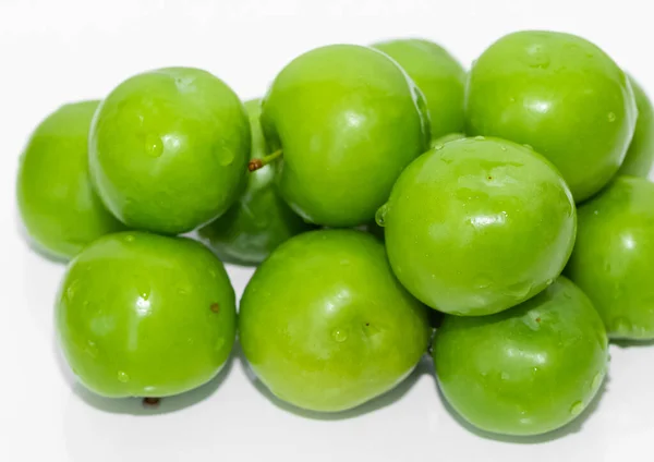 green plum photos on a white background