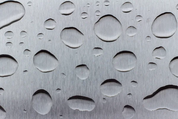概要平滑なステンレス表面の雨滴のアートテクスチャの背景 — ストック写真