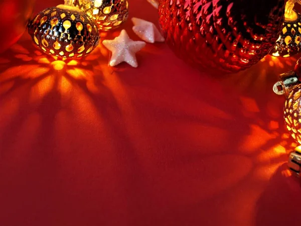 Group of different Christmas balls,toys and lanterns on a red background,Christmas and New Year celebration concept,Christmas card.Close-up,selective focus.