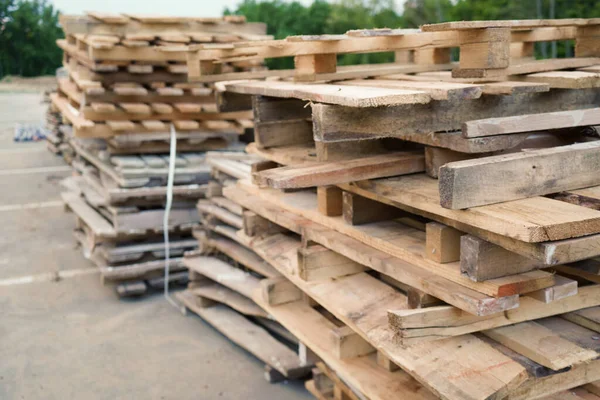 stock image Close-up old wooden pallets.Wood pallet in factory area use for carry material and product supply to customers.Selective focus