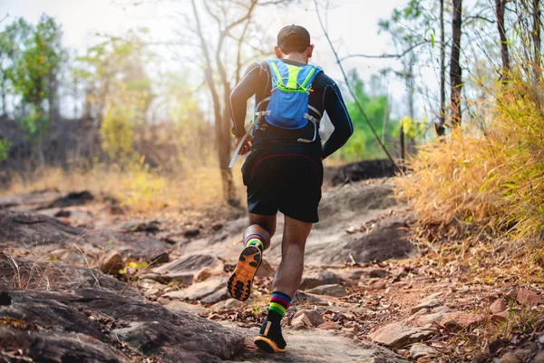 A man Runner of Trail . and athlete's feet wearing sports shoes — Stock Photo, Image