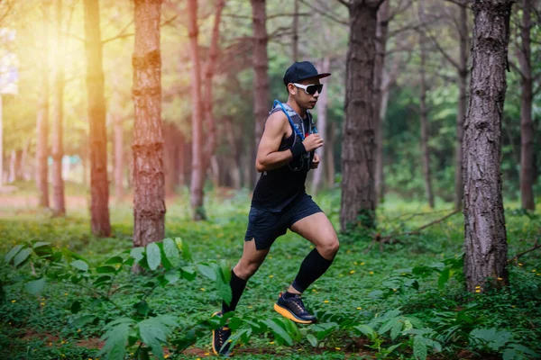 A man Runner of Trail and athlete's feet wearing sports shoes fo — ストック写真