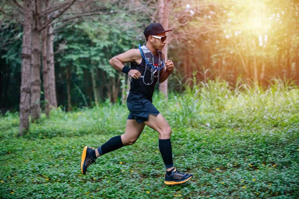 A man Runner of Trail and athlete's feet wearing sports shoes fo — ストック写真
