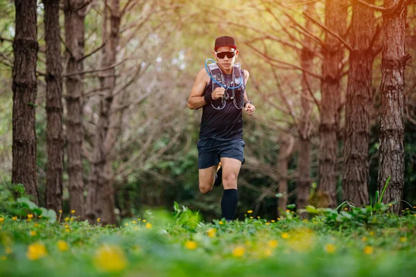 A man Runner of Trail and athlete's feet wearing sports shoes fo — ストック写真