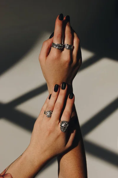 Woman hands with silver rings