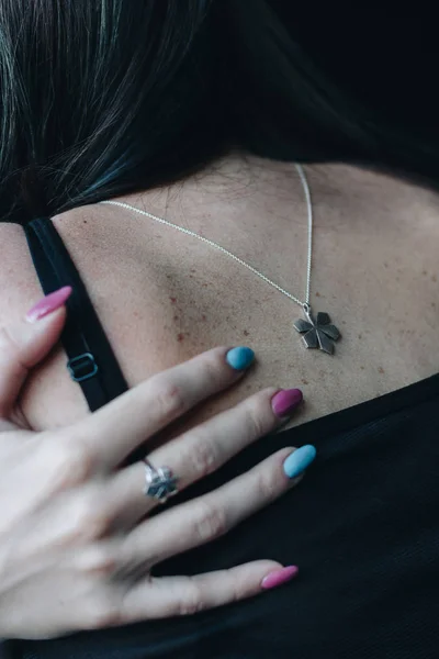 Crop image of young woman hugging herself