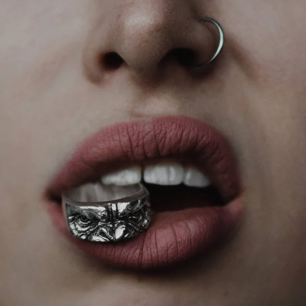 Close Woman Lips Silver Ape Shape Ring Her Teeth — Stock Photo, Image