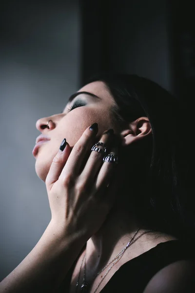 Young woman with silver rings on hand — Stock Photo, Image