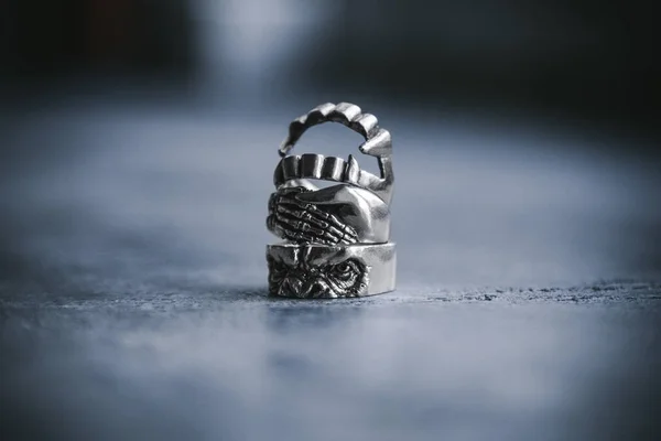 Silver rings on concrete background — Stock Photo, Image