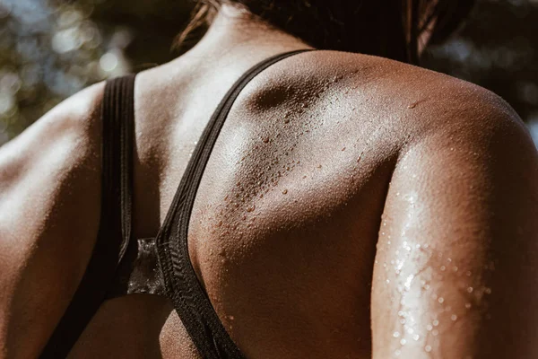 woman back with water drops