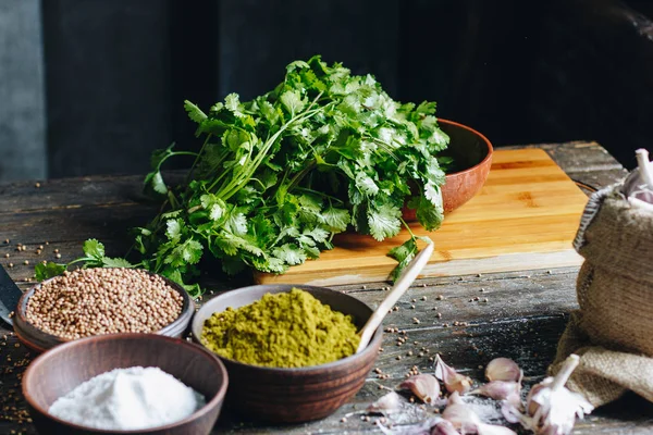 Spices and fresh parsley and cilantro — Stock Photo, Image