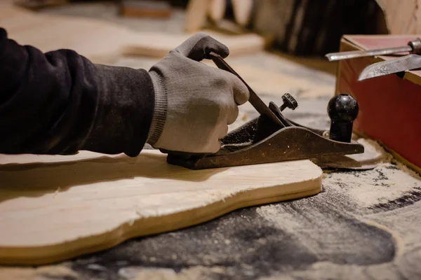 Carpenter working with plane — Stock Photo, Image