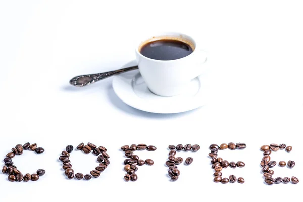 Kopje koffie en belettering koffie — Stockfoto