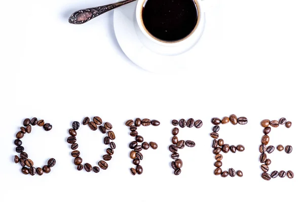 Kopje koffie en belettering koffie — Stockfoto