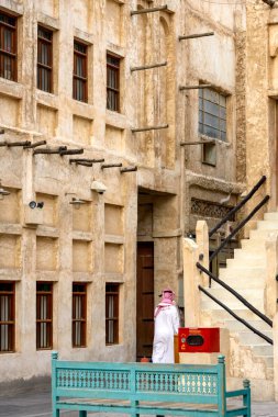 Souq Waqif is a souq in Doha, in the state of Qatar. The souq is noted for selling traditional garments, spices, handicrafts, and souvenirs. It is also home to dozens of restaurants and Shisha lounges. clipart