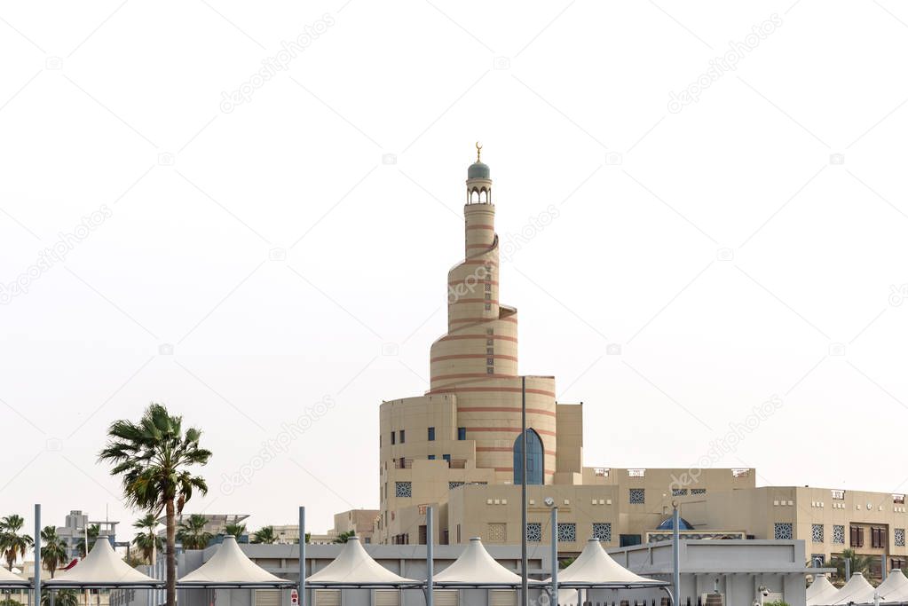 Al fanar view in daytime with canopies all around it