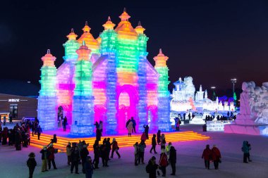 HARBIN, CHINA - JAN 2, 2019: Harbin International Ice and Snow Sculpture Festival is an annual winter festival that takes place in Harbin. It is the world largest ice and snow festival. clipart