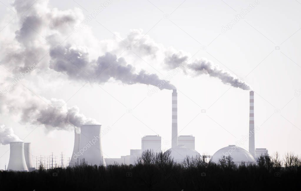 Air pollution by smoke coming out of from factory's chimneys, Industrial zone.