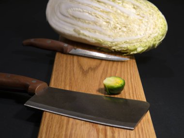Cutting brussels sprouts on a cutting board