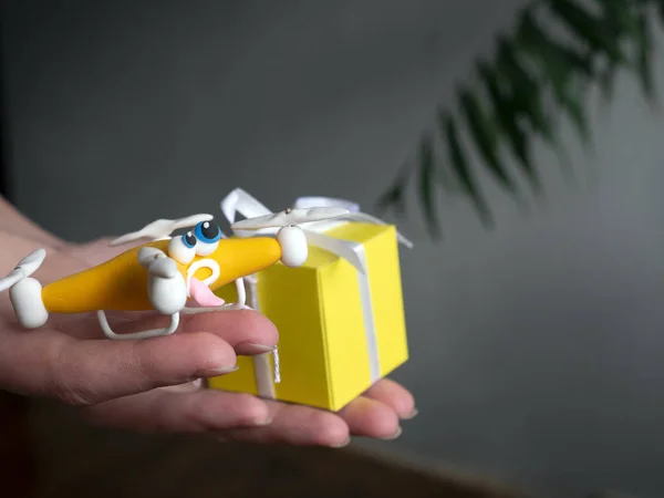 The drone Close up of quadrocopter. Drone with the parcel. With a box. On hands