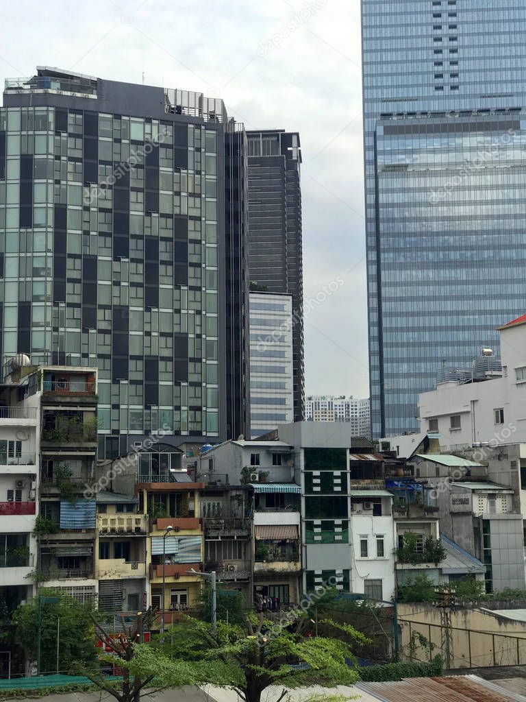 The capital of Cambodia is Phnom Penh. View of the skyscrapers and slums