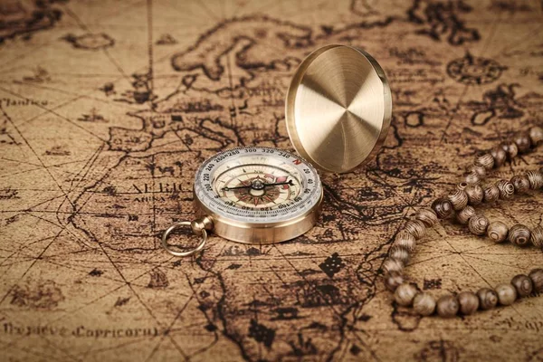 vintage compass on old map - Explore the world-travel concept