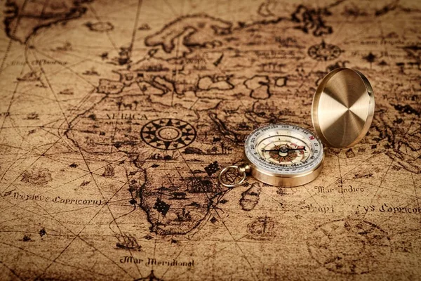 vintage compass on old map - Explore the world-travel concept