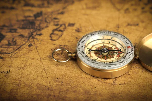 vintage compass on old map - Explore the world-travel concept