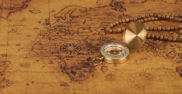 vintage compass on old map - Explore the world-travel concept