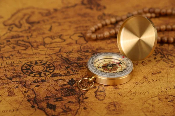 vintage compass on old map - Explore the world-travel concept