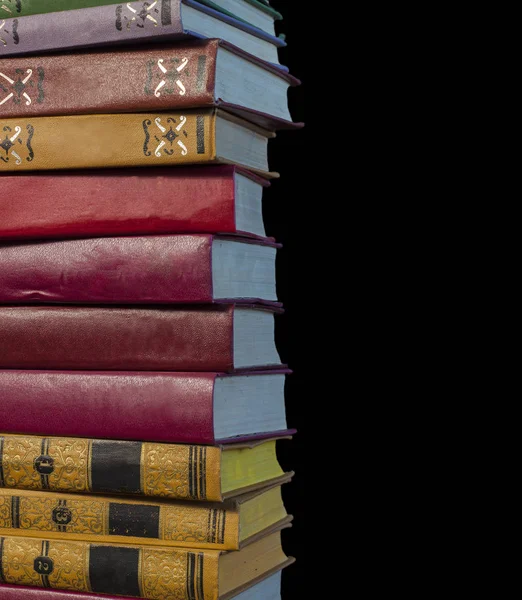 Book in library with old open textbook, stack piles of literature text archive on reading desk, and aisle of bookshelves in school study class room background for academic education learning concept