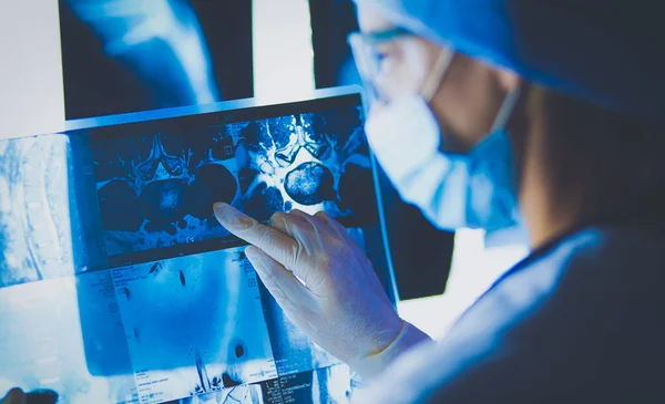 Two female women medical doctors looking at x-rays in a hospital. — Stock Photo, Image