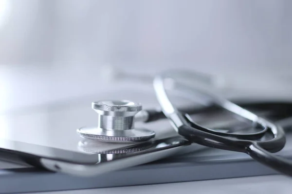 Medical equipment: blue stethoscope and tablet on white background. Medical equipment — Stock Photo, Image