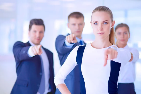 Group of business people pointing to you . Group of business people