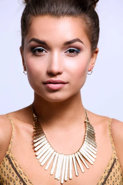 Young beautiful brunette woman with beads. Young beautiful brunette — Stock Photo, Image