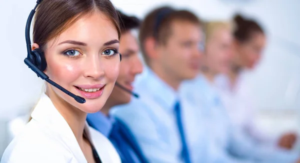 Attractive Smiling positive young businesspeople and colleagues in a call center office — Stock Photo, Image