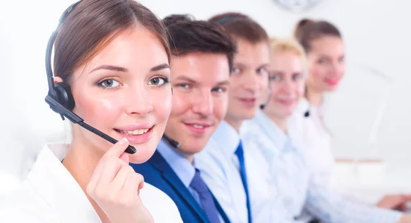 Attractive Smiling positive young businesspeople and colleagues in a call center office — Stock Photo, Image