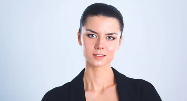 Young woman standing, isolated on gray background — Stock Photo, Image